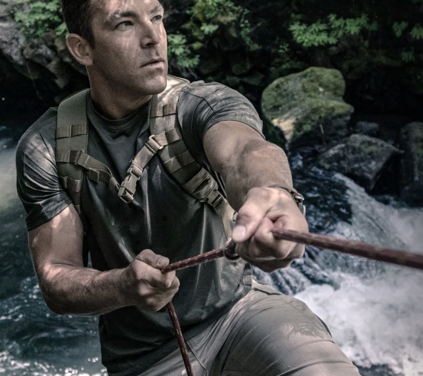 Man outdoors with tactical gear