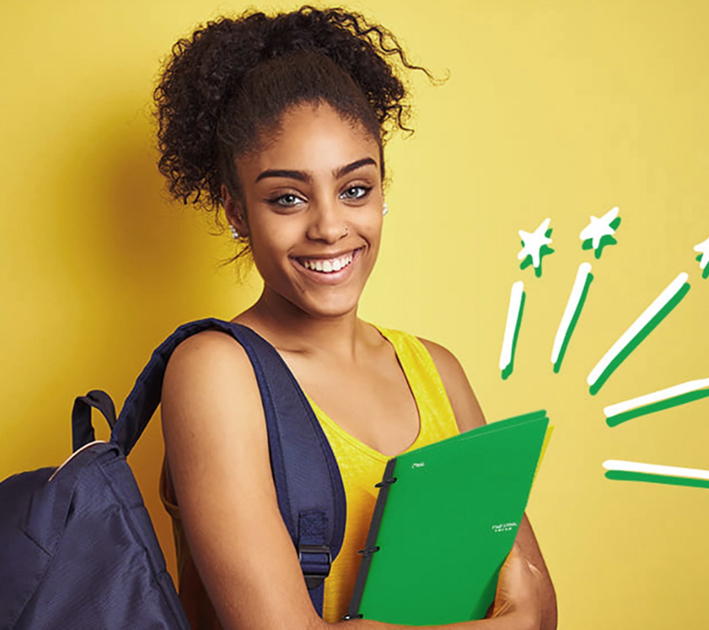 student holding notebook