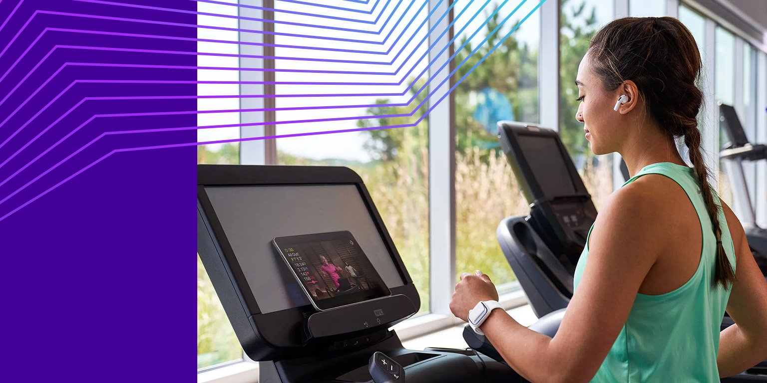 Woman running on a treadmill at Anytime Fitness