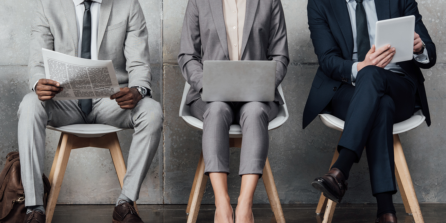 business people sitting in a row