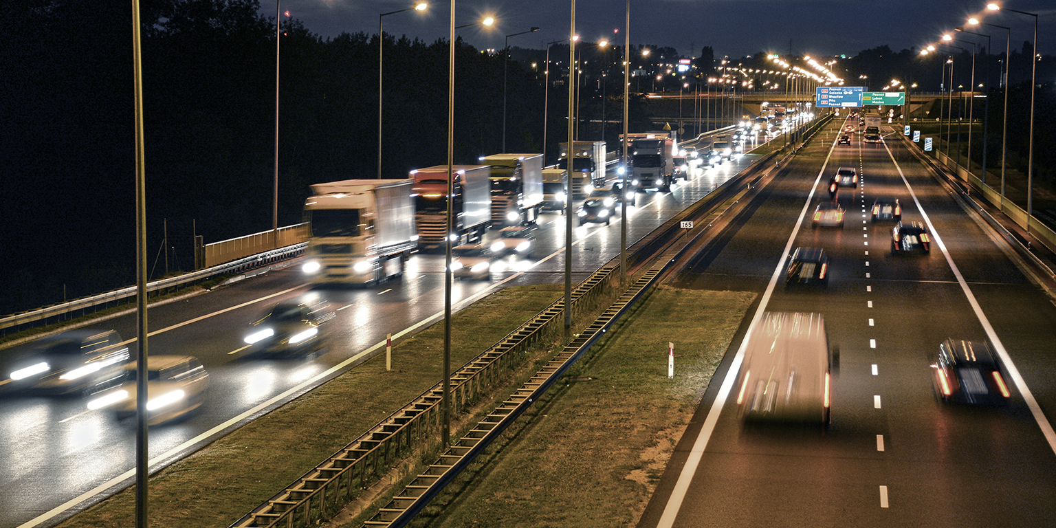 Highway with cargo trucks