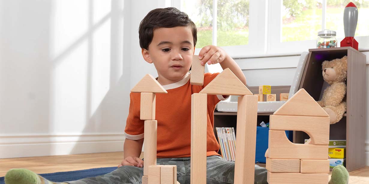 Child playing with wooden blocks