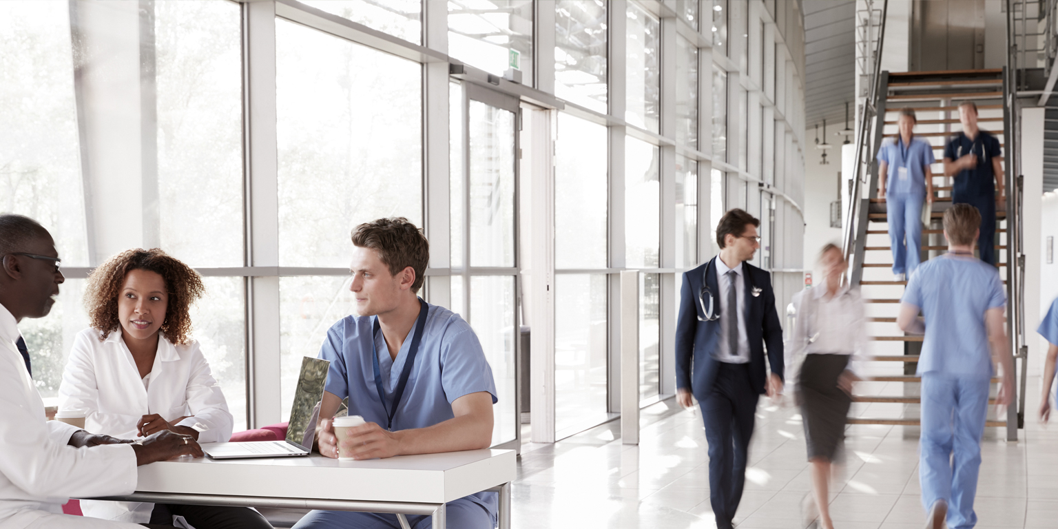 healthcare workers walking in hospital